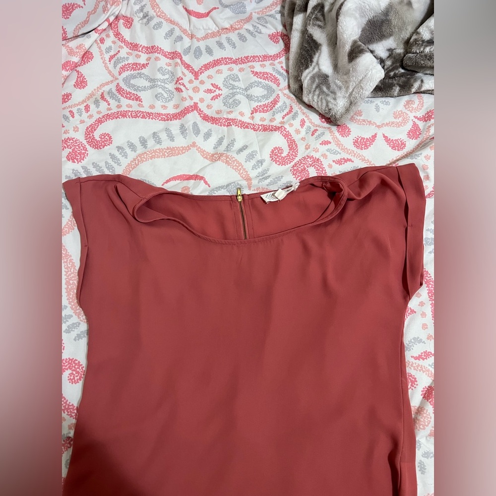 pink top, size s, zipper detail in the back